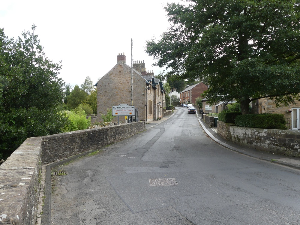 This Picture depicts a sign in Gilsland Village with Northumberland the other half of the village is in Cumbria
