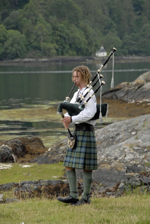 Piper at Eilean Donan Castle