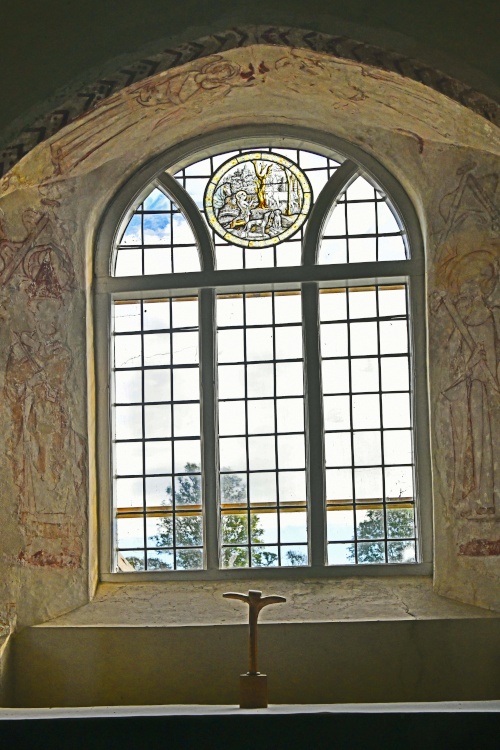 St. Huberts Church, Idsworth - Window surrounded by 14th century paintings