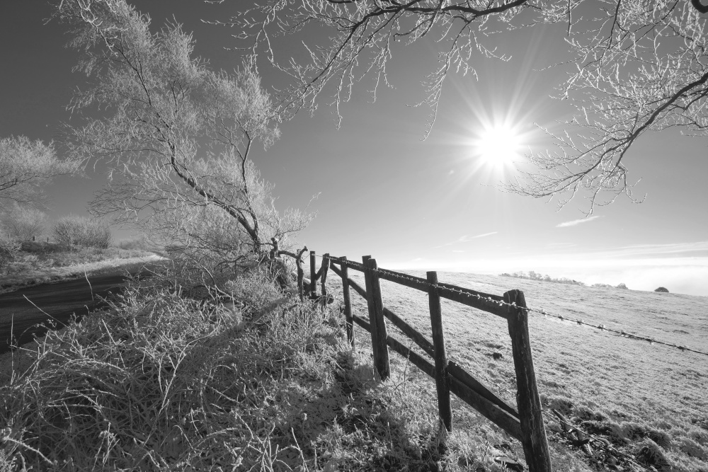 Photograph of Bright sun on snowy Gun Hill above Meerbrook, Staffordshire Moorlands