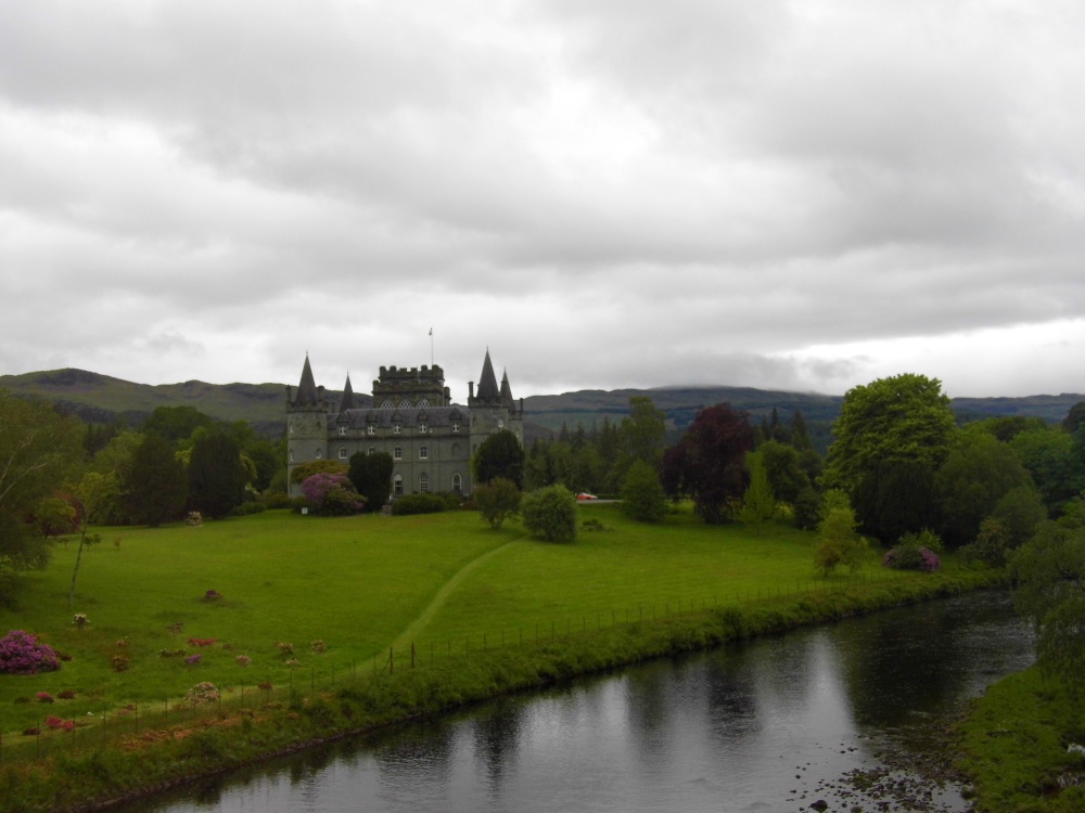 Inveraray Castle, taken from inside the coach going along the road.