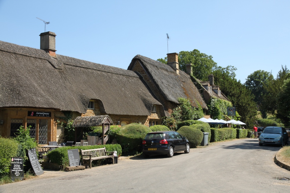 A pretty cafe and The Falklands Arms side by side in Great Tew