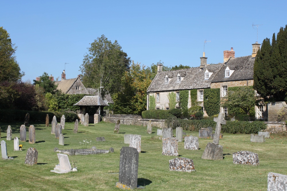 Photograph of An attractive corner of the churchyard at Kingham