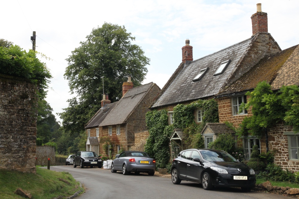 Local honey ironstone cottages in East End, Swerford