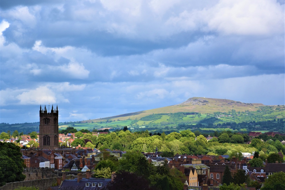 Photograph of Ludlow with Clee Hill in the background.