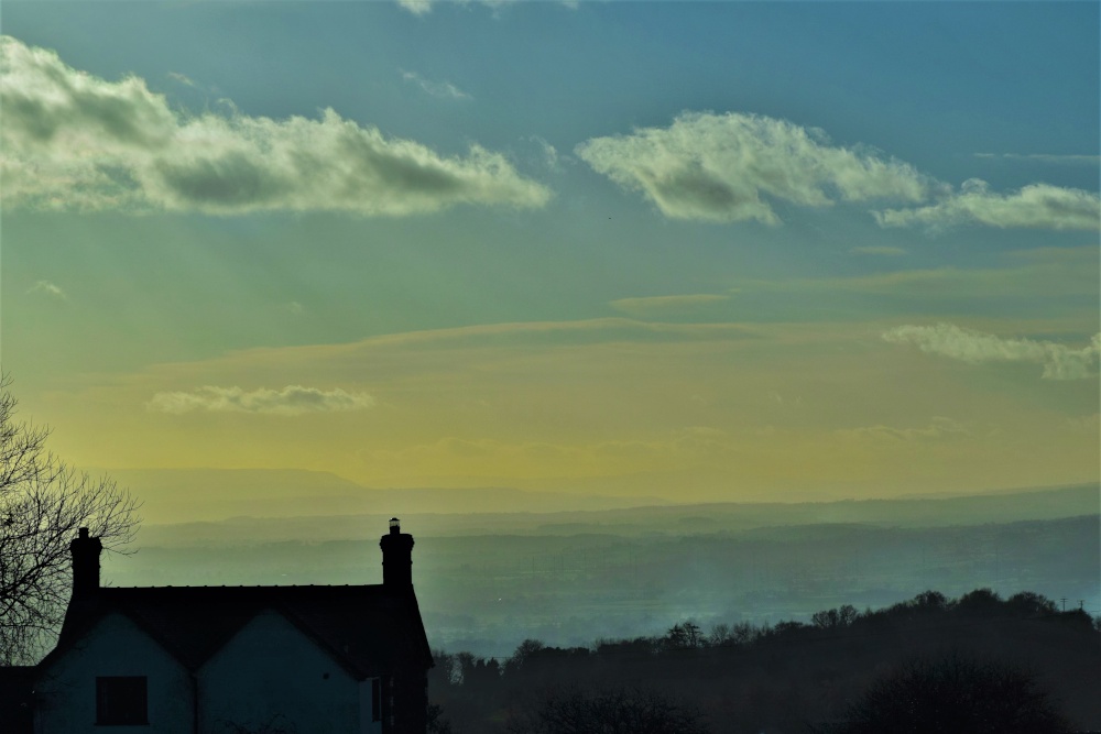 Photograph of Looking west .on a misty afternoon from Cleehill.
