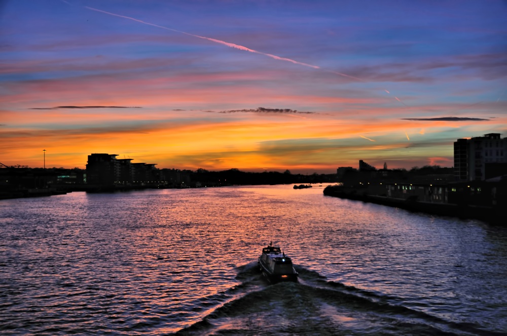 Photograph of Wandsworth Bridge Sunset View with Boat Heading Upstream