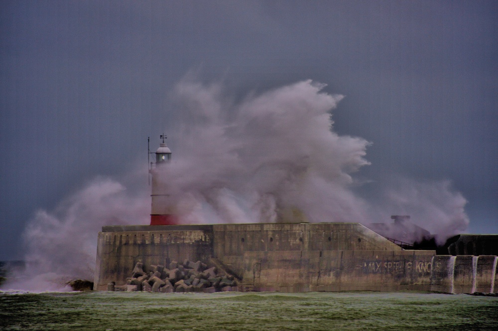 Photograph of Waves Crashing Over the Lighthouse at Newhaven in Sussex