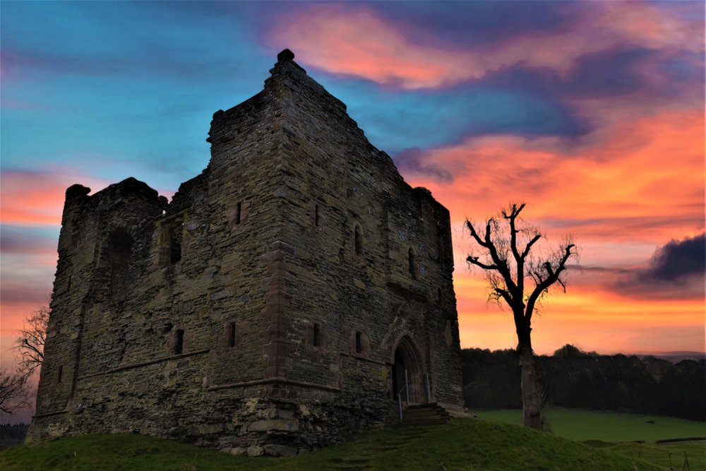 Photograph of Hopton Castle in the evening light